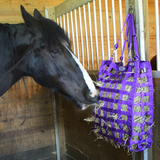 Horse eating out of slow feed hay bag.